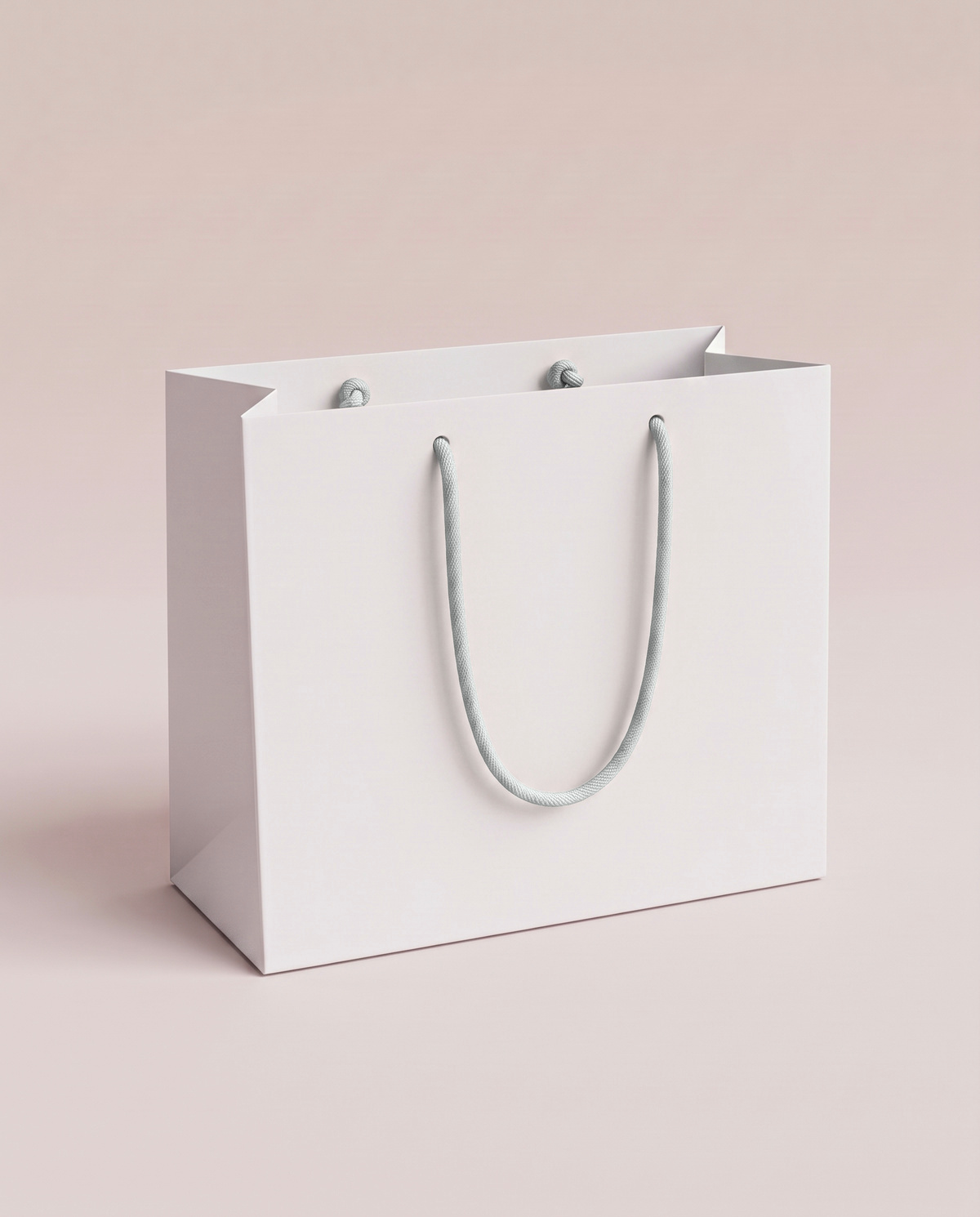 Shopping bag in Coated paper, Knotted · Rounded · Black cord